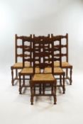 A set of six modern oak ladderback dining chairs with rush seats