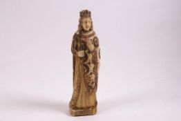 A carved resin figure of a medieval prince,