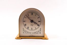 An early-mid 20th century brass eight day desk clock by Davall, retailed by Murgatroyd & Horsfall,