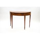 A George III mahogany demi-lune games table with crossbanding and stringing,