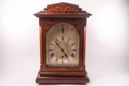 A George III style mahogany bracket clock, with line and swag decoration,