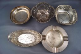 Five silver dishes, comprising; a pierced oval sweet dish with a beaded border,