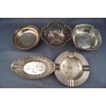 Five silver dishes, comprising; a pierced oval sweet dish with a beaded border,