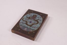 A Japanese rectangular bronze and cloisonne paperweight with central dragon and flaming pearl,