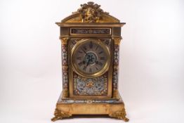 A French clock with Champleve enamel decoration,