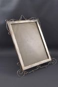 A silver mounted rectangular photograph frame with an open wirework border,