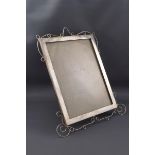 A silver mounted rectangular photograph frame with an open wirework border,