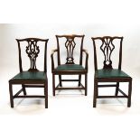 A pair of George III mahogany dining chairs, one a carver, with decorative pierced splats,