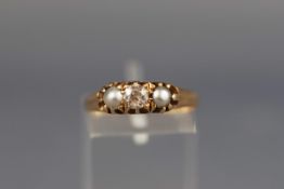 An Edwardian 18ct gold, diamond and half-pearl three stone ring,