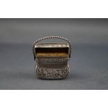 A Victorian silver vinaigrette in the form of a purse or bag,