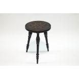 A Welsh carved and stained three legged stool,