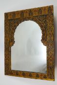 An Islamic style wall mirror, ornately painted with Middle Eastern motifs,