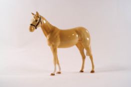 A Beswick model of a Palomino show pony, modelled by Shane Ridge, printed factory mark, 17cm high,