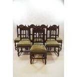 A set of eight late Victorian carved oak dining chairs,