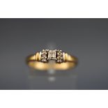 A hallmarked 18ct gold ring set with a millenium cut diamond measuring 3.40mm x 2.