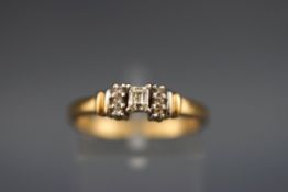 A hallmarked 18ct gold ring set with a millenium cut diamond measuring 3.40mm x 2.