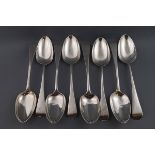 Two composite sets of four George III and Victorian table spoons,