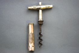An early 19th century silver mounted travelling corkscrew, 7.