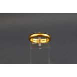 A hallmarked 22ct gold wedding ring. Gross weight: 7.