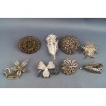 A selection of eight silver brooches each of fine filigree floral design. Gross weight; 48.