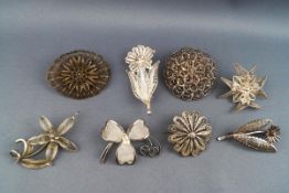 A selection of eight silver brooches each of fine filigree floral design. Gross weight; 48.