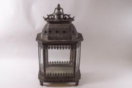 An ornate metal eight sided lantern,
