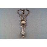 A pair of Victorian silver sugar nips, with bright cut decoration engraved "LM",