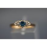 A hallmarked 9 carat dress ring set with a heart shaped blue topaz and diamond shoulders. 2.