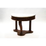 A Victorian mahogany demi-lune wash stand with marble top over a deep frieze and one shaped leg