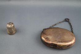 A Victorian oval silver purse with suspension chain, London 1881,