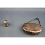 A Victorian oval silver purse with suspension chain, London 1881,