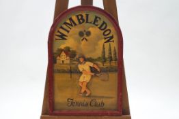 A painted wood 'Wimbledon Tennis Club' sign with applied figure on the tennis court, 61cm high x 41.