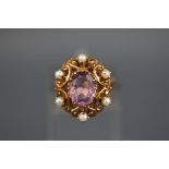 A 9 carat gold amethyst and seed pearl abstract cluster ring, Hallmarked 9ct, London. 5.