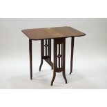 An Edwardian mahogany Sutherland table with triple slat slides,