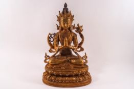 A 20th century South East Asian gilt metal figure of a deity, possibly Tara or Amitayus,