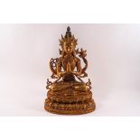 A 20th century South East Asian gilt metal figure of a deity, possibly Tara or Amitayus,