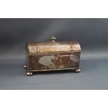 A silver plated inkwell, of domed casket form on four ball feet,
