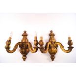 A pair of carved wood two branch and gilded wall lights,
