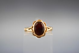 A single stone garnet ring. Stamped 9ct. Gross weight: 2.