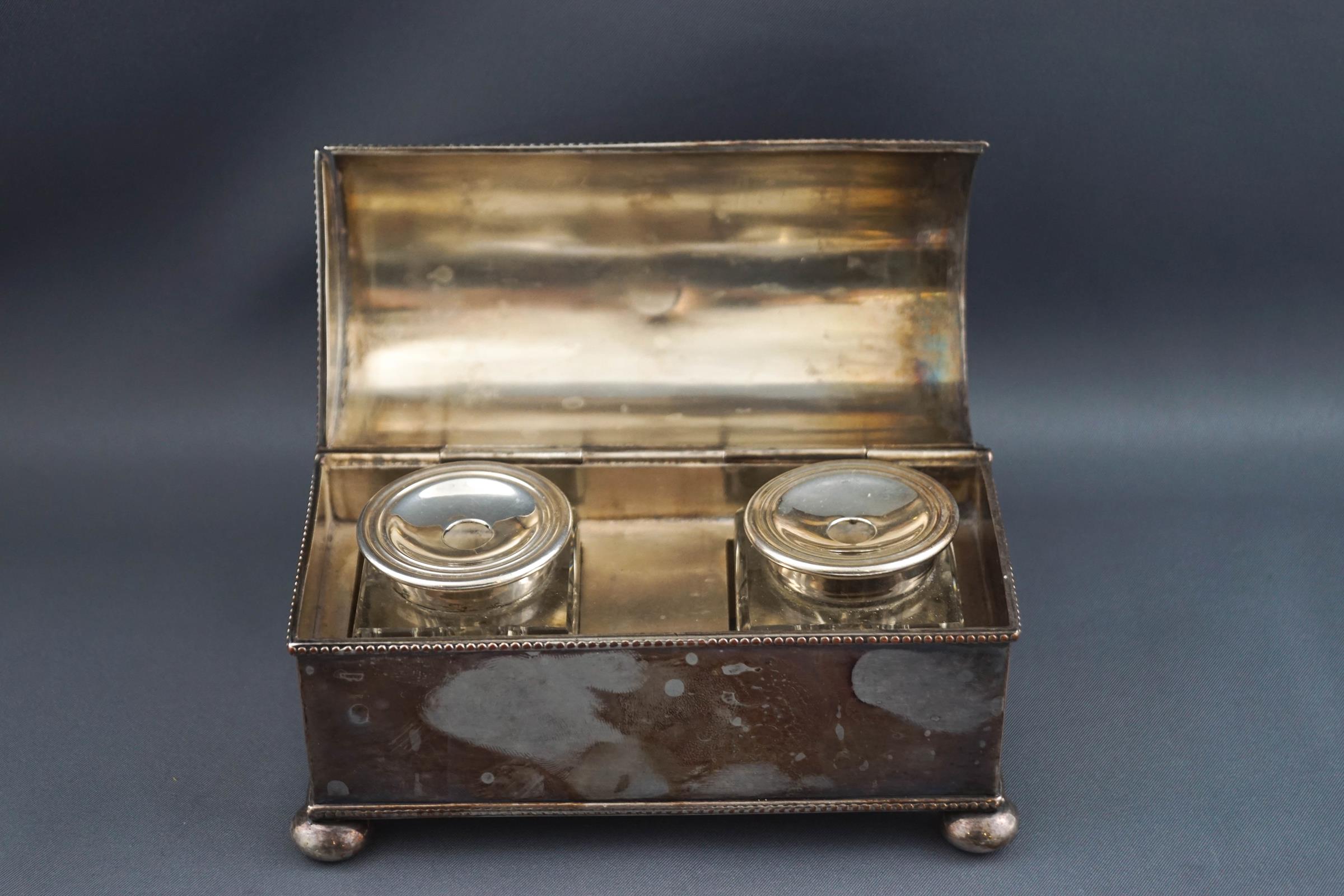 A silver plated inkwell, of domed casket form on four ball feet, - Image 2 of 2