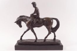 A 20th century bronze of a jockey up, on slate base,