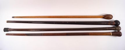 Four heavy wooden walking sticks,