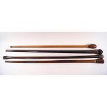 Four heavy wooden walking sticks,