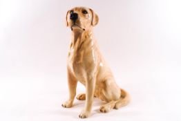 A Beswick fireside model of a Golden Labrador, model 2314, printed and impressed factory marks,