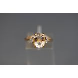 A 9 carat rock crystal quartz and aquamarine three stone ring, hallmarked 9ct gold, Birmingham,