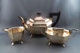 A silver three piece tea service, of canted rectangular form,