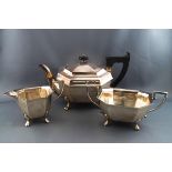 A silver three piece tea service, of canted rectangular form,