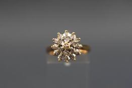 A hallmarked 9ct gold flower cluster ring set with nineteen single cut diamonds measuring