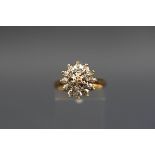 A hallmarked 9ct gold flower cluster ring set with nineteen single cut diamonds measuring