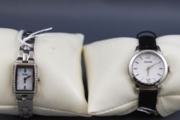 A collection of two boxed Pulsar wristwatches: a lady's stainless steel watch with leather strap